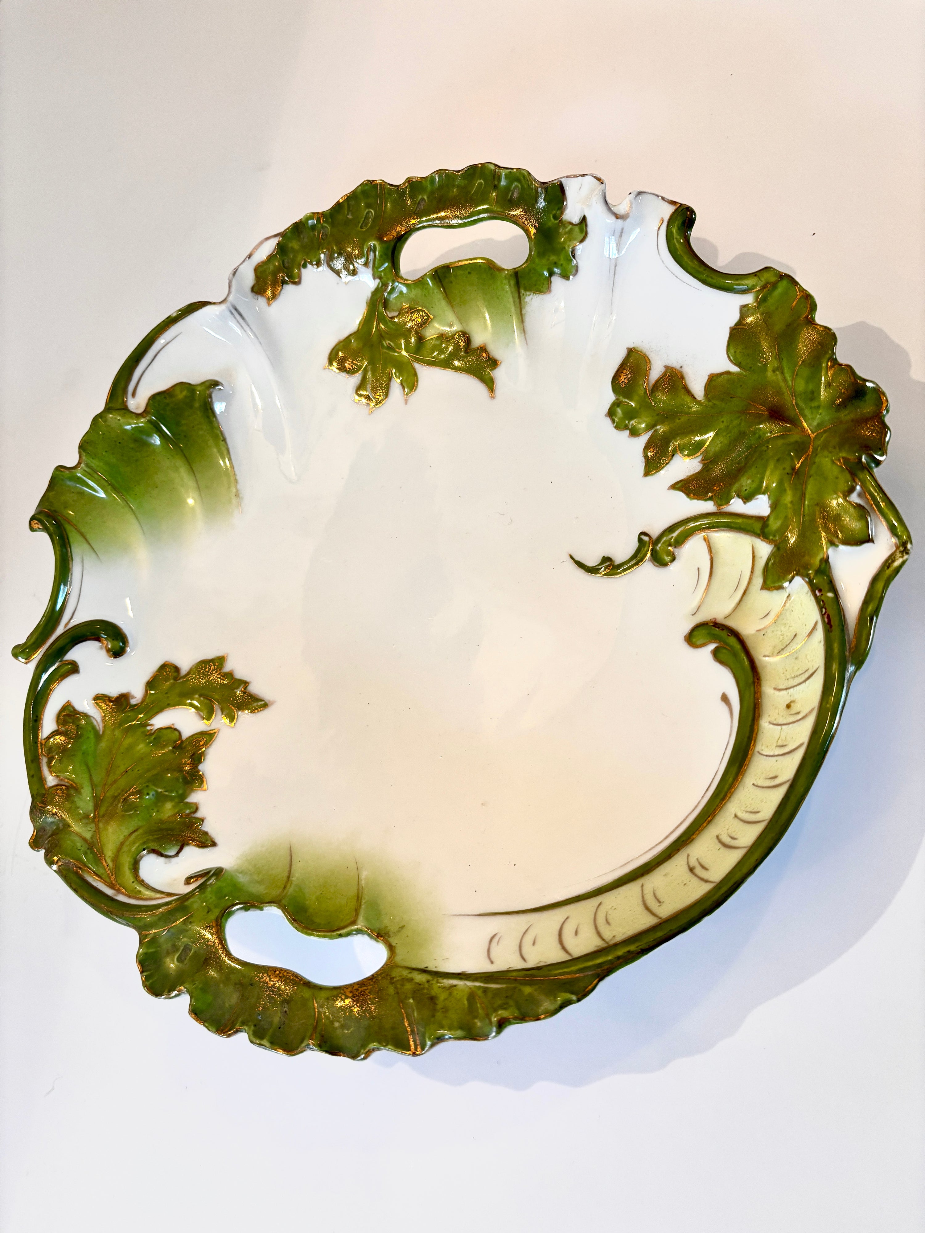 Porcelain plate, green and gold leaf detail