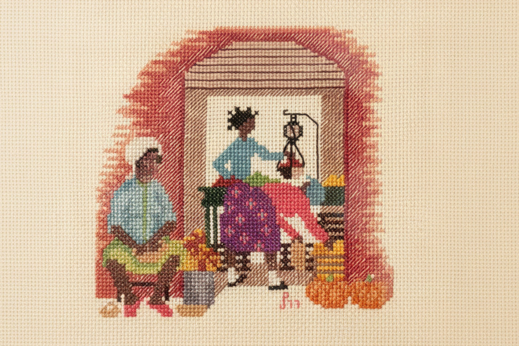 Vintage 9-inch needlepoint of three women among pumpkins and produce