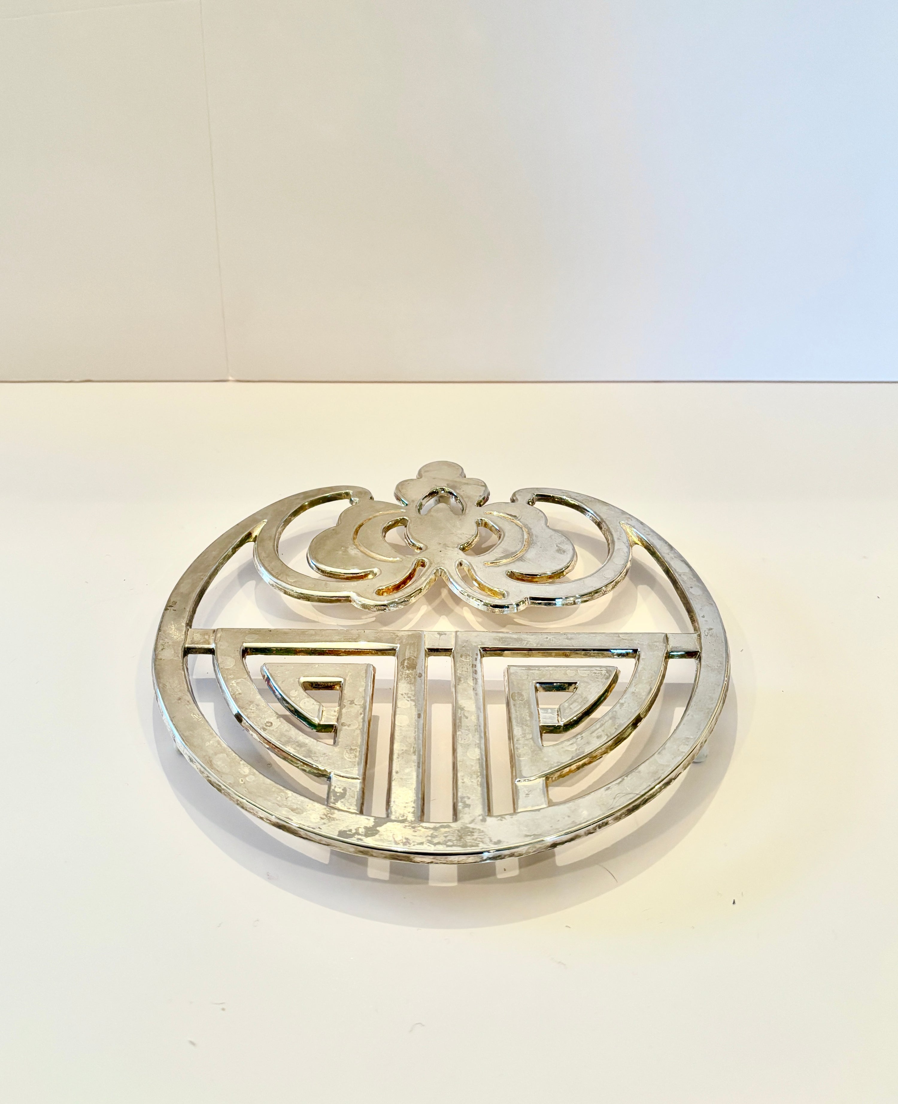 Vintage silver-plated trivet with an Art Deco and Art Nouveau motif