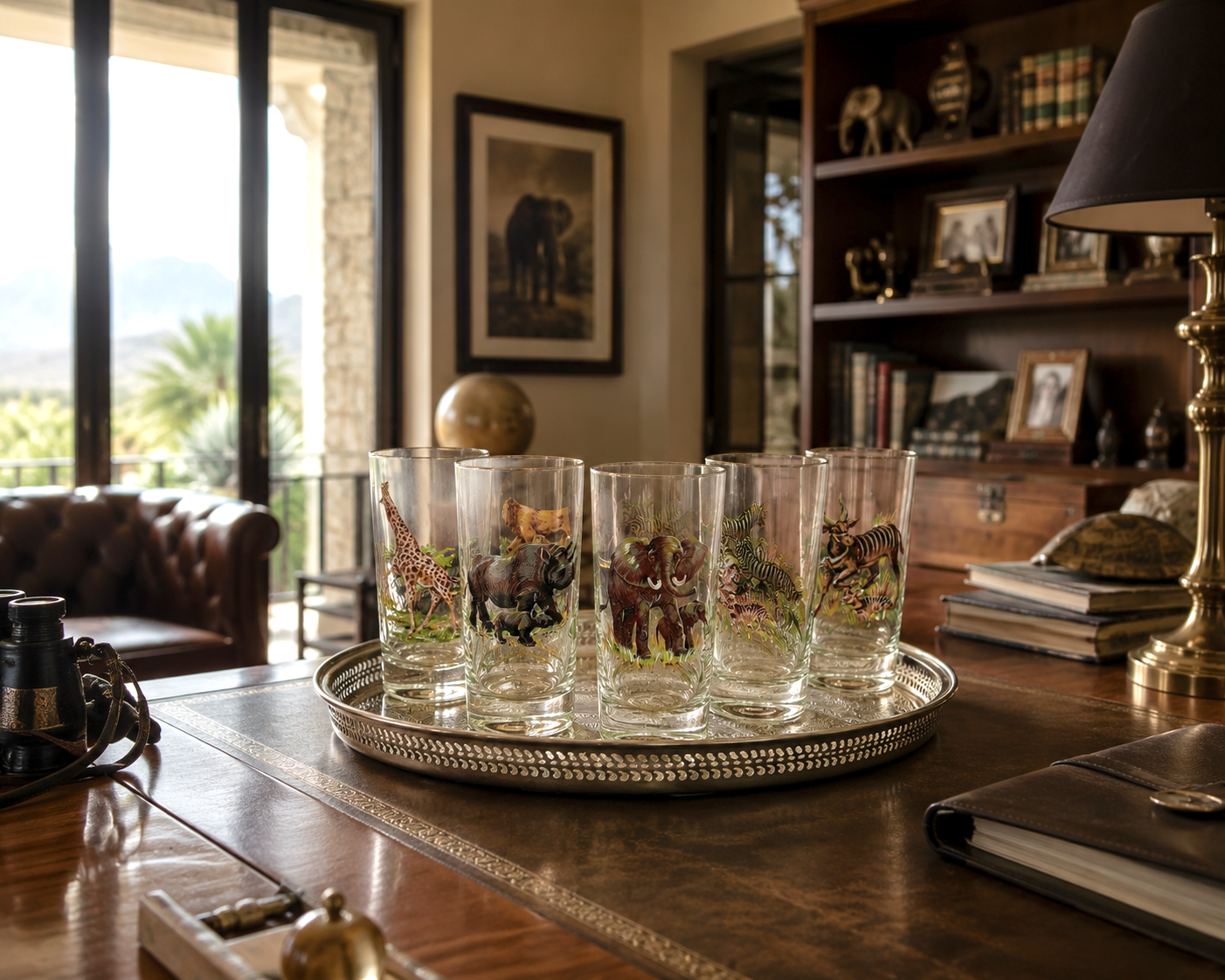 Vintage safari highball glasses on a silver-plated gallery tray