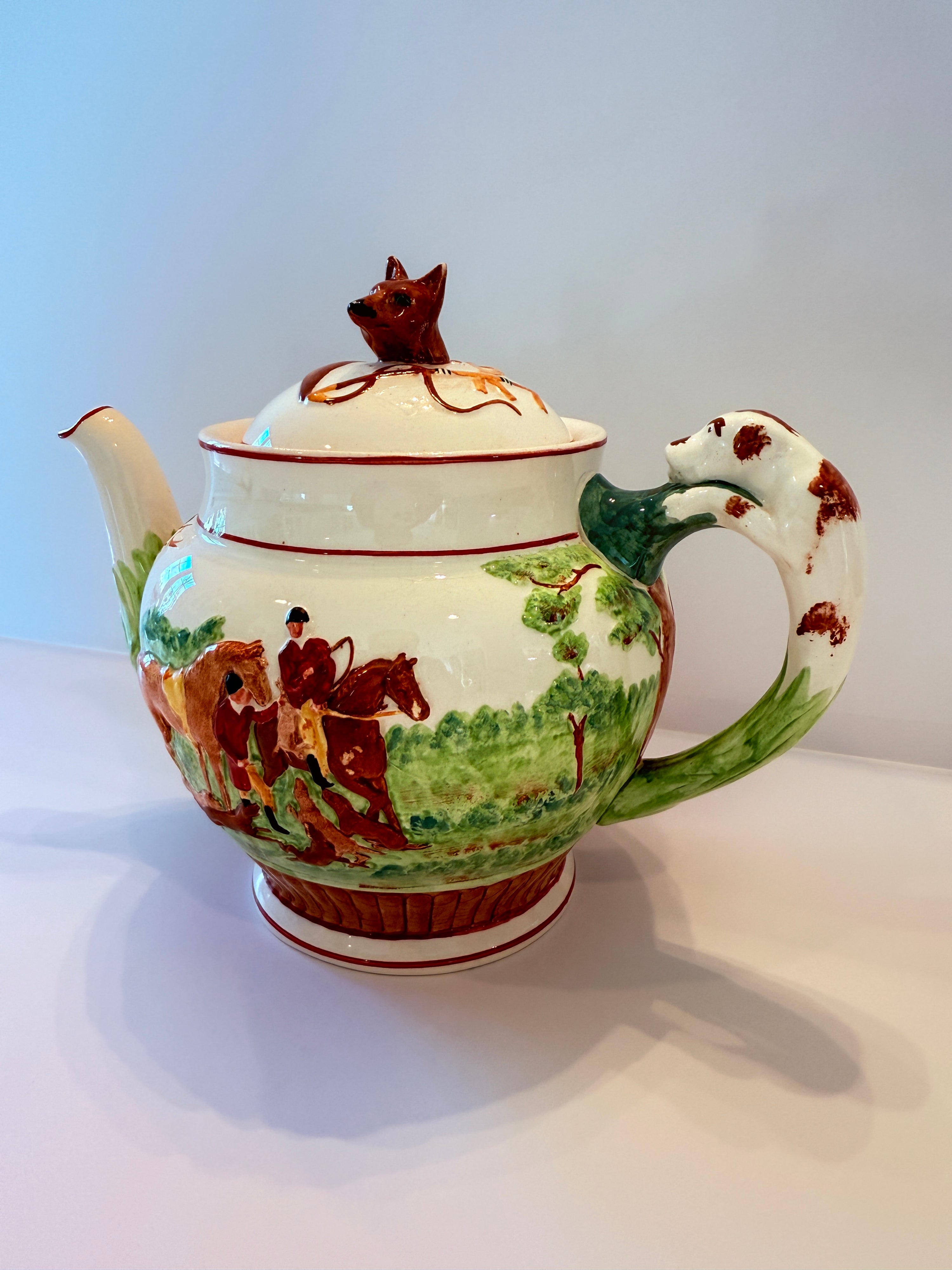 Hunt-scene teapot, fox finial detail