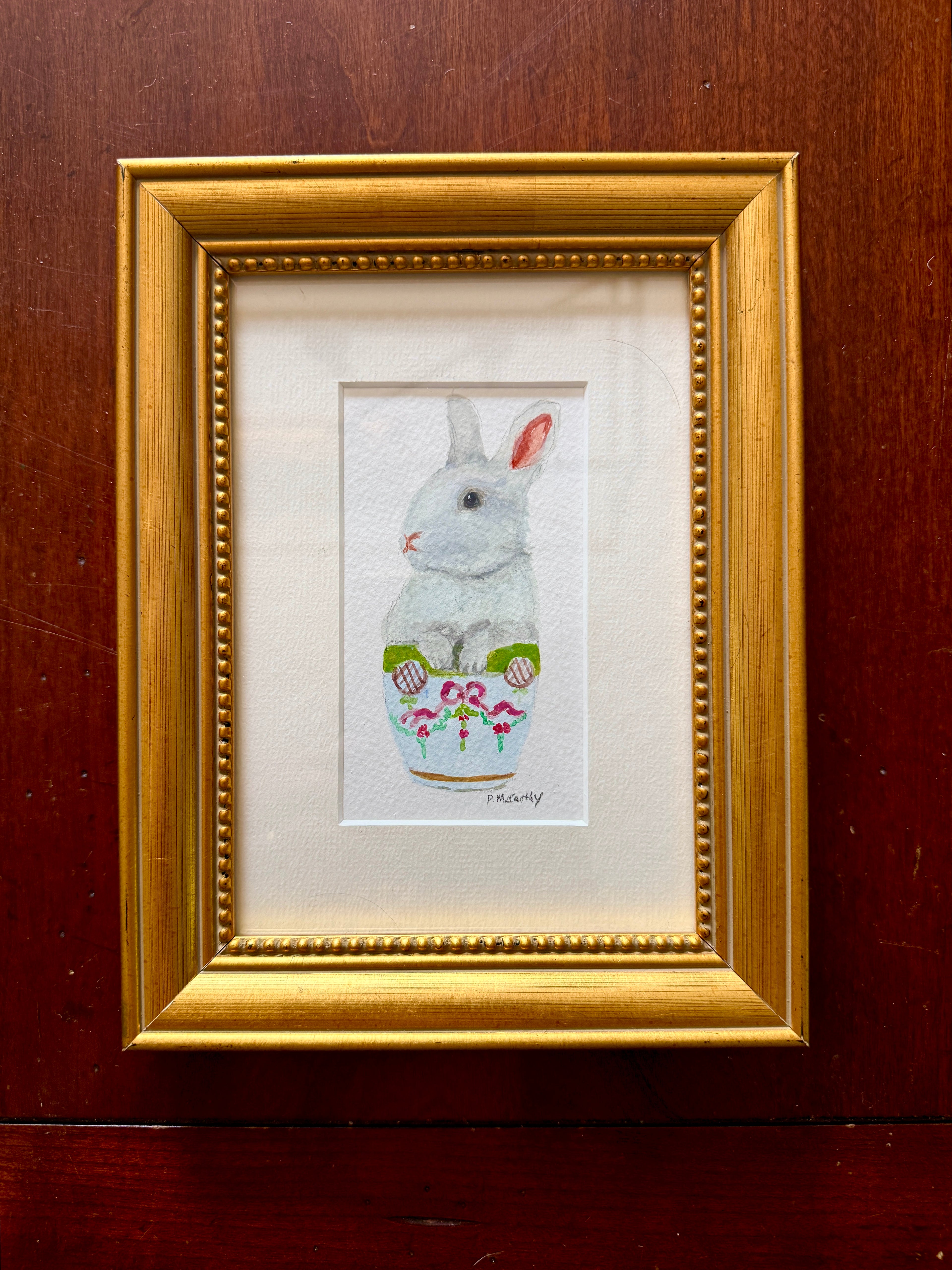 Pat McCarthy Bunny in Ribbon &amp; Rose Cachepot — Original Watercolor, Gold Beaded Frame