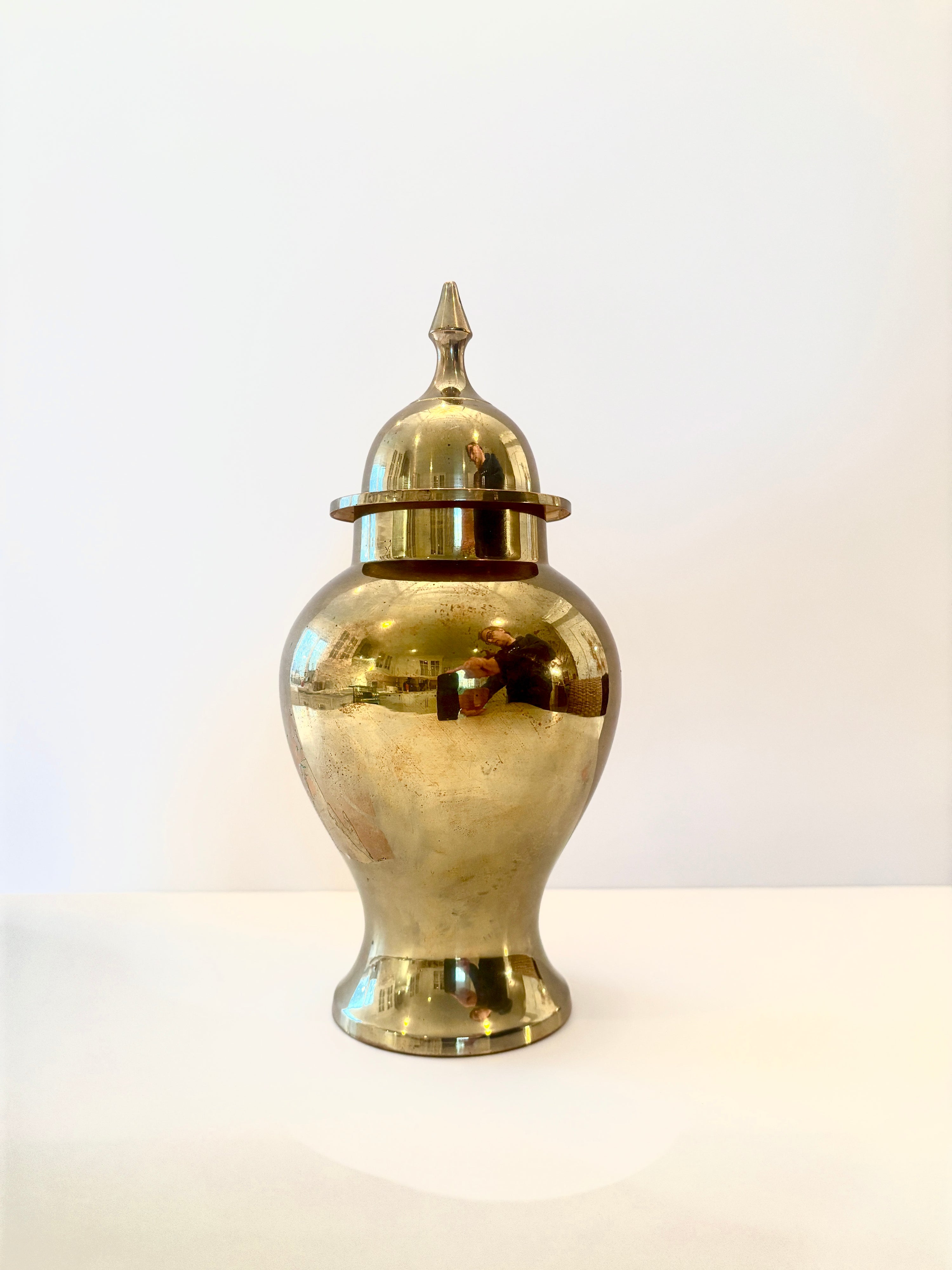 9-inch solid brass temple jar with a pointed lid and polished finish