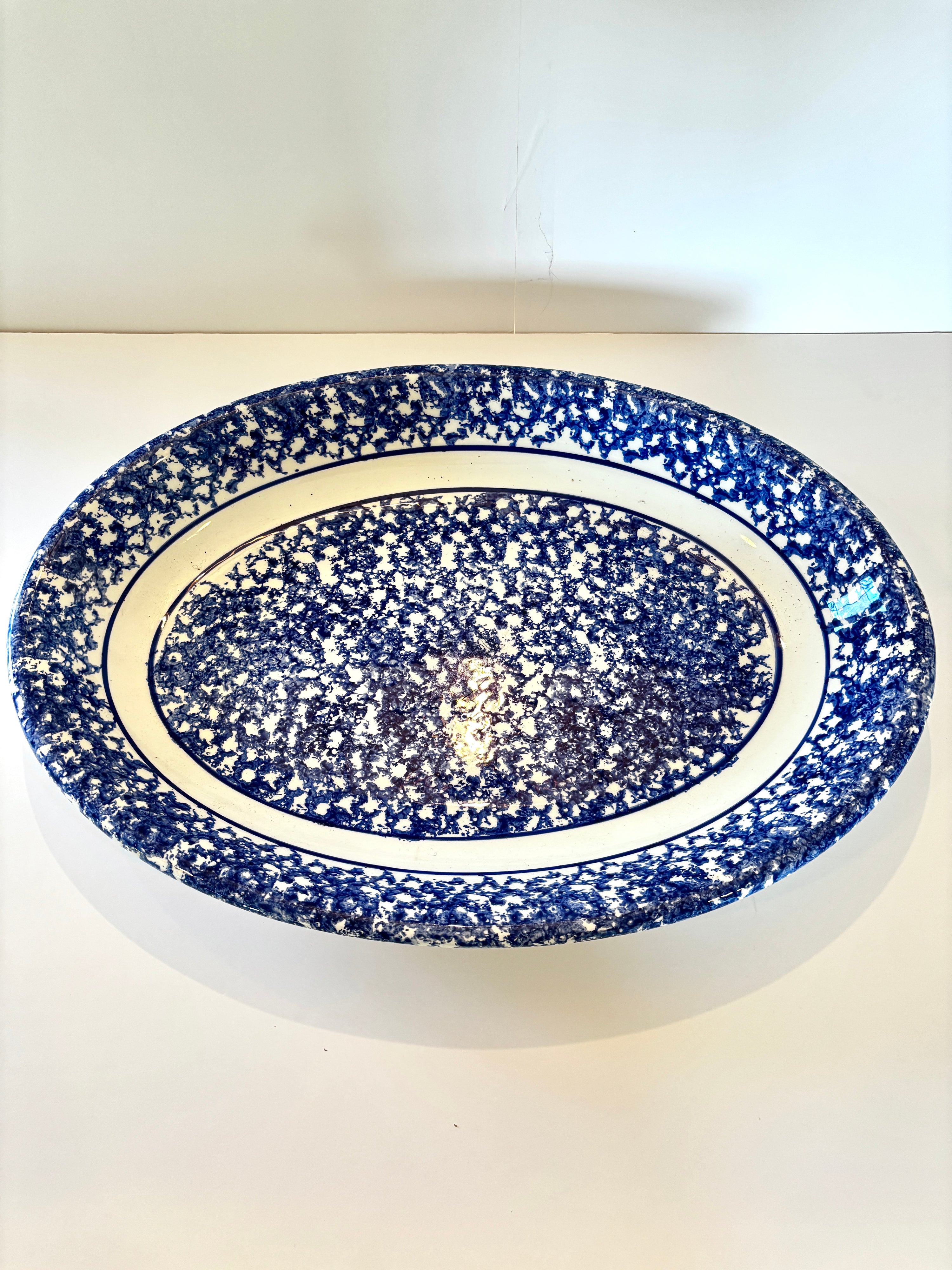 Vintage blue spongeware platter, speckle detail