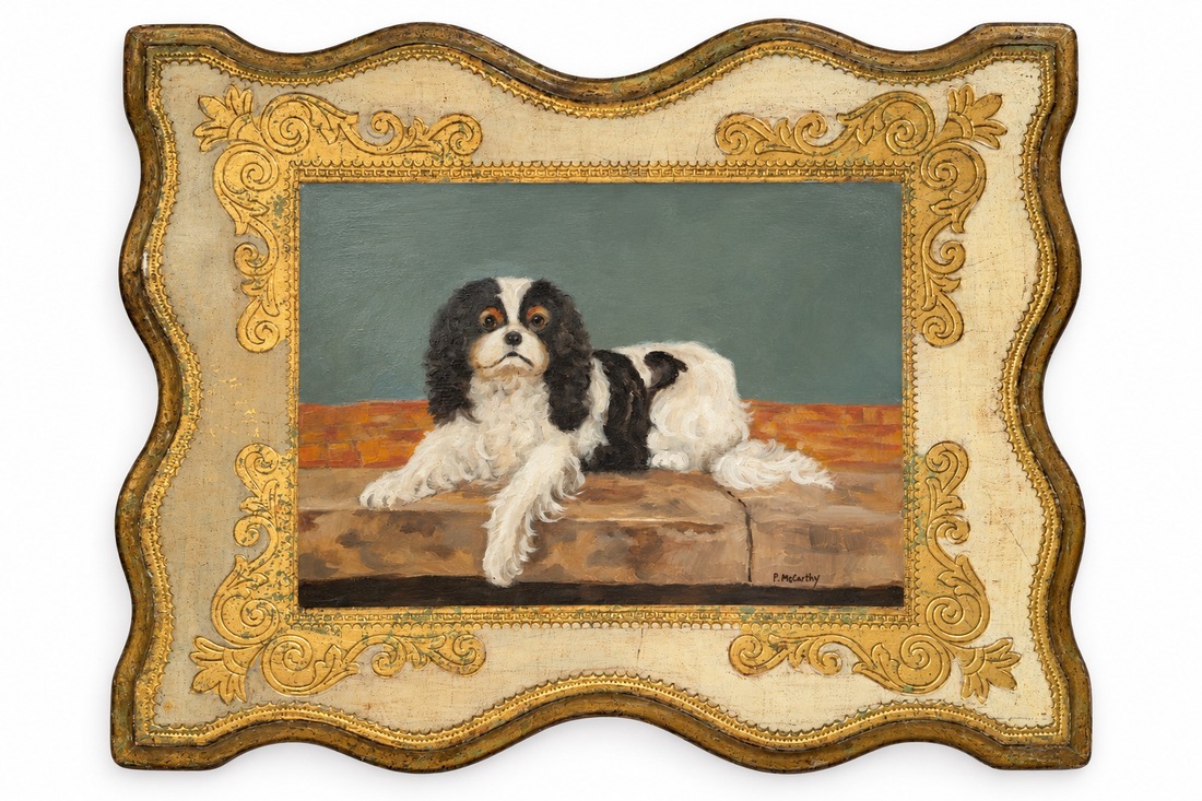 Pat McCarthy oil of a black and white spaniel on a stone ledge, ivory and gilt frame