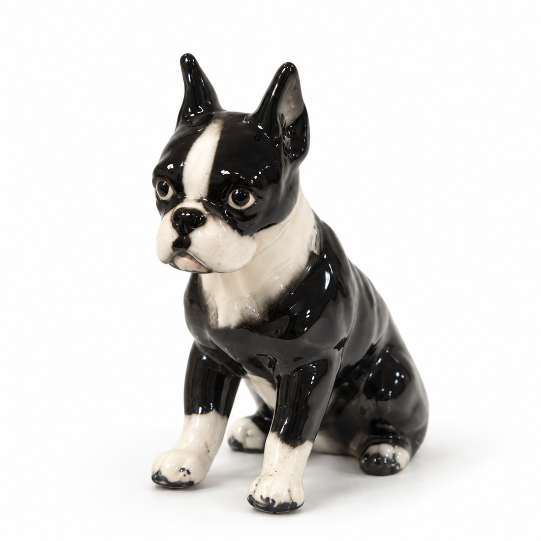 Vintage hand-painted porcelain seated Boston terrier figurine, 4 inches tall, on a white background