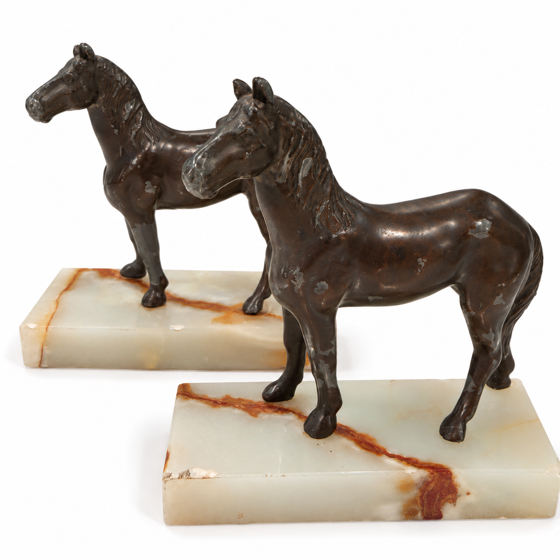 Onyx and painted white metal horse bookends, front view on white