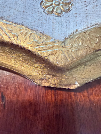 Close-up of the small chip in the gilt at the bottom edge of the Florentine board