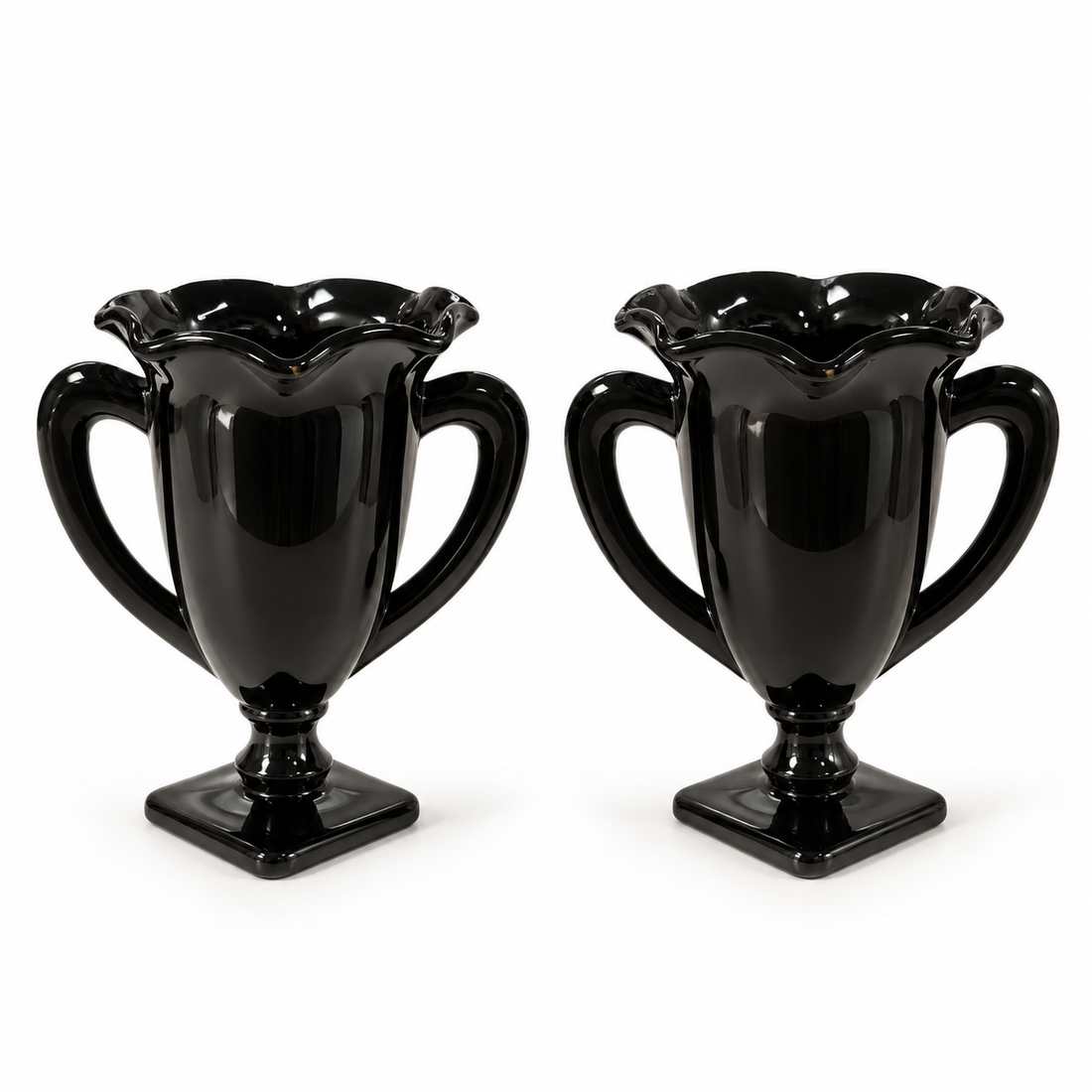 Pair of L.E. Smith black amethyst glass trophy vases with ruffled rims and square feet, 7 inches tall, on a white background