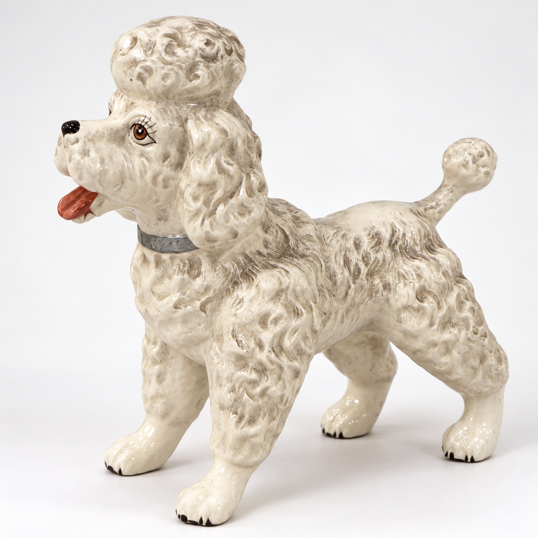 Vintage Norcrest Japan white and gray porcelain standing poodle figurine with silver collar, 8 inches tall, on a white background