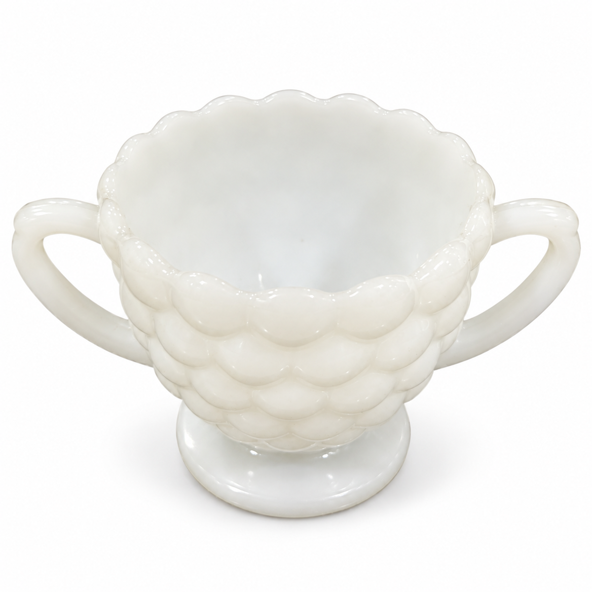 Vintage white milk glass bubble pattern sugar bowl with two handles, on white background