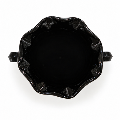 Looking down into the second black amethyst glass trophy vase of the pair, on white background