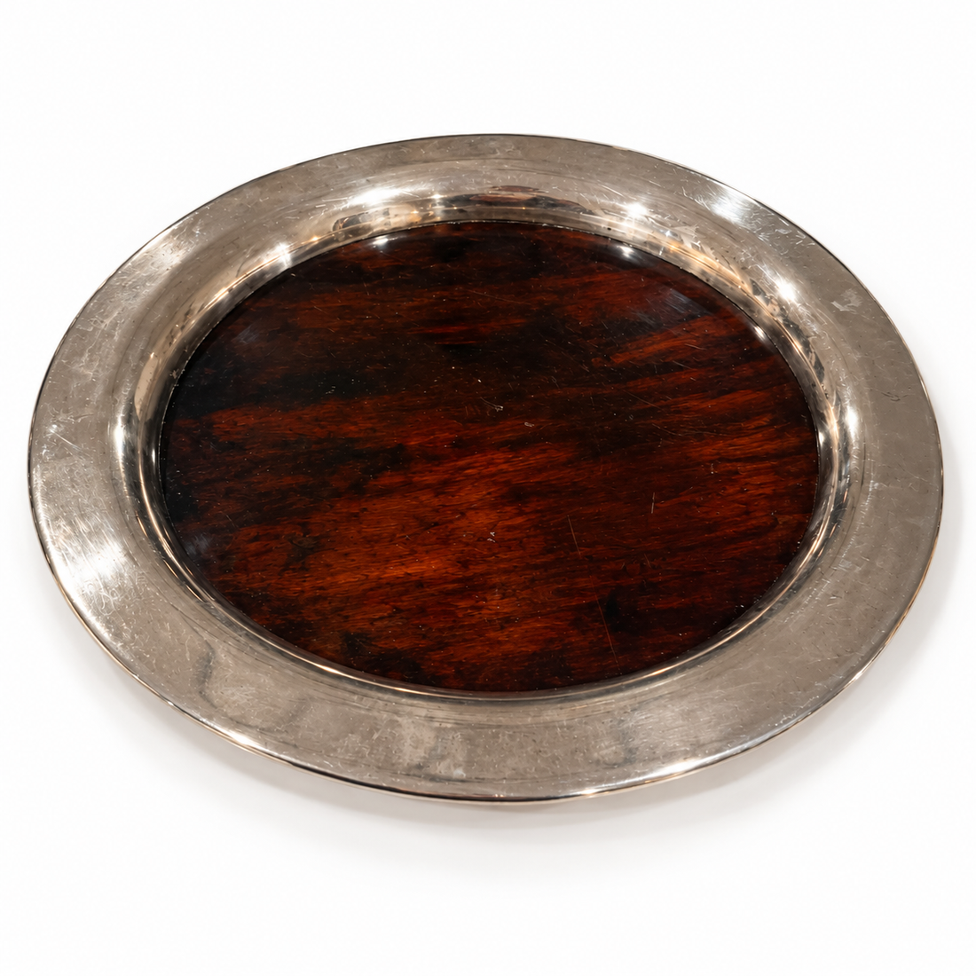 Round silver-tone rim tray with dark wood center, on white