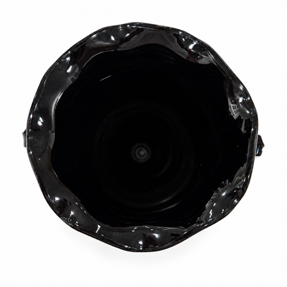 Looking down into L.E. Smith black amethyst trophy vase with ruffled rim, on white background